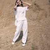 Baltos laisvesnio silueto lininės kelnės